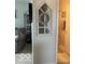 A charming faux window adorned with a decorative wreath accents this hallway near the bathroom at 2231 Abbey St, Brownsburg, IN 46112