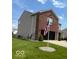 Two-story home boasts a brick and vinyl exterior, a well-kept lawn, and an American flag waving proudly at 2231 Abbey St, Brownsburg, IN 46112