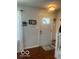 Inviting entryway with hardwood floors, decorative accents, and a secure door for peace of mind at 2231 Abbey St, Brownsburg, IN 46112