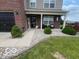Traditional home boasting neat landscaping, a front door wreath, and a cozy, inviting entrance at 2231 Abbey St, Brownsburg, IN 46112