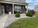 Charming brick home featuring well-manicured landscaping and a welcoming front porch at 2231 Abbey St, Brownsburg, IN 46112