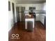 Well-lit kitchen with stainless steel appliances and a butcher block island, perfect for cooking at 2231 Abbey St, Brownsburg, IN 46112