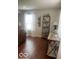 Cozy living room with decorative shelving, a table, and lots of natural light at 2231 Abbey St, Brownsburg, IN 46112