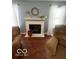 Living room with fireplace, neutral paint and curtains, and comfortable seating area at 2231 Abbey St, Brownsburg, IN 46112