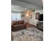 Comfortable living room featuring seating, an area rug, television, and stairs at 2231 Abbey St, Brownsburg, IN 46112