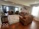 Inviting living room with a comfortable sofa, area rug and a traditional fireplace at 2231 Abbey St, Brownsburg, IN 46112