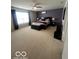 Expansive primary bedroom featuring carpet, large windows, a ceiling fan and tasteful decor at 2231 Abbey St, Brownsburg, IN 46112