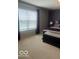 Bright main bedroom boasting large windows, plush carpeting, and modern furnishings at 2231 Abbey St, Brownsburg, IN 46112
