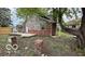 Backyard features a small deck, grass, and a large tree providing shade at 252 Ringwood Way, Anderson, IN 46013