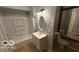 Bathroom featuring a vanity and a shower and tub combo, with lots of natural light at 252 Ringwood Way, Anderson, IN 46013