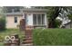Classic one-story home featuring a screened-in porch with brick stairs on a lush lawn at 252 Ringwood Way, Anderson, IN 46013