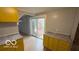 Bright kitchen featuring bright cabinetry, wood-look laminate flooring and large windows at 252 Ringwood Way, Anderson, IN 46013