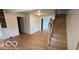 View of a living room featuring wooden floors and staircase to the right at 252 Ringwood Way, Anderson, IN 46013