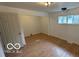 Living room featuring wood-look laminate flooring, with a window letting in lots of natural light at 252 Ringwood Way, Anderson, IN 46013