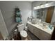 Hall bathroom with ample vanity storage space, tile accent, and modern fixtures at 2937 S Allen Dr, New Palestine, IN 46163