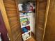 Hallway closet with adjustable shelving for organized storage space and wooden bi-fold doors at 2937 S Allen Dr, New Palestine, IN 46163