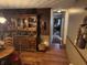 Cozy dining room flows to hallway and features hardwood floors and vintage hutch at 2937 S Allen Dr, New Palestine, IN 46163