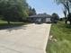 Spacious driveway leading to a brick home, with ample parking and a well-kept lawn in a quiet neighborhood at 2937 S Allen Dr, New Palestine, IN 46163