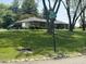 Street view highlighting mature trees and a well-maintained lawn, showing a traditional home on a corner lot at 2937 S Allen Dr, New Palestine, IN 46163