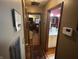 Hallway view showcasing the flooring and access to the bathroom at 2937 S Allen Dr, New Palestine, IN 46163