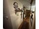 Hallway with decorative touches, hardwood floors, and stylish lighting fixtures at 2937 S Allen Dr, New Palestine, IN 46163