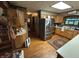 Bright kitchen features stainless steel appliances, wood cabinets, and natural light at 2937 S Allen Dr, New Palestine, IN 46163