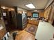 Bright kitchen features stainless steel appliances, wood cabinets, and natural light at 2937 S Allen Dr, New Palestine, IN 46163