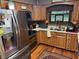 Bright kitchen features stainless steel appliances, wood cabinets, and natural light at 2937 S Allen Dr, New Palestine, IN 46163