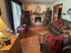 Cozy living room with a beautiful stone fireplace and hardwood floors at 2937 S Allen Dr, New Palestine, IN 46163