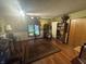 Living room featuring a large rug, vintage cabinet, and natural light from the window at 2937 S Allen Dr, New Palestine, IN 46163