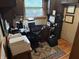 Home office with a desk, printer, filing cabinet, and natural light, creating a productive workspace at 2937 S Allen Dr, New Palestine, IN 46163