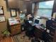 Home office with a desk, printer, filing cabinet, and natural light, creating a productive workspace at 2937 S Allen Dr, New Palestine, IN 46163
