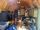 Inside storage shed shows tools, bins and cabinets for organization in this backyard space at 2937 S Allen Dr, New Palestine, IN 46163