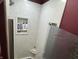 Bright shower featuring tile accent wall, built-in shelves, and rain shower fixture at 2937 S Allen Dr, New Palestine, IN 46163