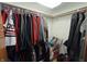 Spacious walk-in closet with organized hanging clothes and shelving for optimal storage solutions at 2937 S Allen Dr, New Palestine, IN 46163