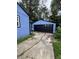 Exterior view of home with detached garage and long driveway at 3201 W 22Nd St, Indianapolis, IN 46222