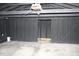 Spacious garage with a modern door opener, paneled walls, and concrete flooring at 3201 W 22Nd St, Indianapolis, IN 46222