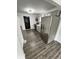 Modern kitchen with stainless steel appliances, gray cabinets, and wood floors, offering functionality at 3201 W 22Nd St, Indianapolis, IN 46222