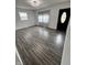 Bright living room with wood floors and natural light, creating a welcoming atmosphere for relaxation at 3201 W 22Nd St, Indianapolis, IN 46222