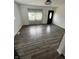 Bright living room with wood floors and natural light, creating a welcoming atmosphere for relaxation at 3201 W 22Nd St, Indianapolis, IN 46222