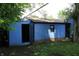The matching detached garage or shed in the rear yard offers extra storage space at 3201 W 22Nd St, Indianapolis, IN 46222
