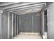 Interior view of the shed with framed walls and ceiling, offering potential for customization and use at 3201 W 22Nd St, Indianapolis, IN 46222