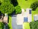 Aerial view of the home highlighting the beautiful landscaping, solar panels, and unique architecture at 3265 Tulip Dr, Indianapolis, IN 46227