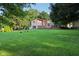 Beautifully landscaped backyard with mature trees and ample space at 3265 Tulip Dr, Indianapolis, IN 46227