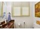 Cozy bathroom with a round mirror at 3265 Tulip Dr, Indianapolis, IN 46227