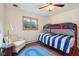Bedroom features a wooden floor, bunk bed, and comfortable seating area at 3265 Tulip Dr, Indianapolis, IN 46227