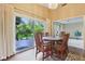 Dining room area features wood floors and access to the outdoor deck at 3265 Tulip Dr, Indianapolis, IN 46227