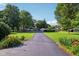 Long, paved driveway leads to a secluded home surrounded by greenery at 3265 Tulip Dr, Indianapolis, IN 46227