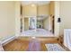 Inviting foyer with a unique layout and hardwood floors, showcasing architectural design at 3265 Tulip Dr, Indianapolis, IN 46227