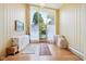 Bright foyer with hardwood floors and a large window that offers a view of outdoors at 3265 Tulip Dr, Indianapolis, IN 46227